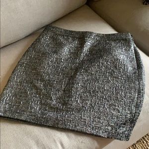 Silver mini skirt. New with tag. Size 4.